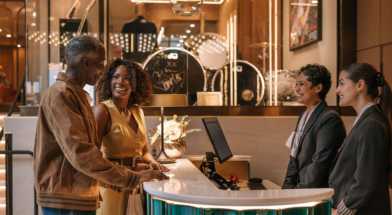 HRH-Couple Checking In At A Hotel